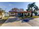 Charming single story home with stone veneer, tile roof, solar panels and a well-maintained front yard at 120 60Th Ave, St Pete Beach, FL 33706