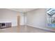 Bright and airy living room with beverage center, tile flooring and lanai access with pool view at 1201 Blue Shell Loop, Sarasota, FL 34240
