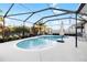 Inviting kidney-shaped pool with a screened enclosure at 13634 Ashlar Slate Pl, Riverview, FL 33579