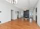 Bright living room with hardwood floors, white trim, and a black painted brick fireplace at 1405 Nance Ave, Tampa, FL 33606