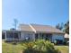 Charming single story home with a screened in porch, attached garage and a well maintained front lawn at 18231 Steele Ave, Port Charlotte, FL 33948