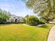 Beautiful home with lush landscaping and a long driveway at 19107 Centre Rose Blvd, Lutz, FL 33558