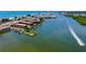 Gorgeous aerial view of condos on the water with a view of the ocean and a jetski at 19701 Gulf Blvd # 328, Indian Shores, FL 33785