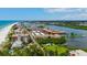 Stunning aerial view of the coastal community, showcasing the beach, waterways, and residential buildings at 19701 Gulf Blvd # 328, Indian Shores, FL 33785