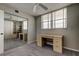 Bedroom with a large desk, storage cabinets, and a ceiling fan at 19701 Gulf Blvd # 328, Indian Shores, FL 33785