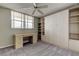 Bedroom featuring a ceiling fan, desk, built in cabinets, and wall to wall carpet at 19701 Gulf Blvd # 328, Indian Shores, FL 33785