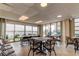 Community room featuring multiple tables and chairs with bright light and water views at 19701 Gulf Blvd # 328, Indian Shores, FL 33785