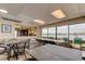 Community dining room with large windows offering scenic water views and comfortable seating at 19701 Gulf Blvd # 328, Indian Shores, FL 33785