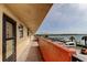Exterior condo corridor with access to units and scenic water view with boat docks at 19701 Gulf Blvd # 328, Indian Shores, FL 33785