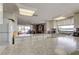 Bright kitchen features granite counters, white cabinets, and a window overlooking the yard at 19701 Gulf Blvd # 328, Indian Shores, FL 33785
