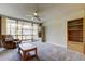 Inviting living room featuring comfortable seating, a ceiling fan, and sliding glass doors to the lanai at 19701 Gulf Blvd # 328, Indian Shores, FL 33785