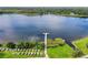Scenic aerial view of lake with community dock and available kayaks for resident enjoyment at 2100 World Parkway Blvd # 56, Clearwater, FL 33763