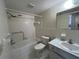 Clean bathroom featuring a bathtub and shower combination, vanity, and toilet at 2100 World Parkway Blvd # 56, Clearwater, FL 33763