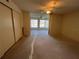 Bedroom featuring a ceiling fan, closet space, and attached sunroom with large windows at 2100 World Parkway Blvd # 56, Clearwater, FL 33763