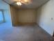 Open living area with ceiling fan and ample natural light, ready for your design vision at 2100 World Parkway Blvd # 56, Clearwater, FL 33763