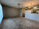 Spacious living room featuring a ceiling fan and vintage lighting at 2100 World Parkway Blvd # 56, Clearwater, FL 33763