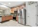 Well-lit kitchen featuring stainless steel appliances, granite countertops, and tile backsplash at 2110 Wolfskill Pl, Riverview, FL 33578