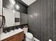 Modern bathroom with herringbone tile and a floating vanity at 2302 Village Amble Loop, Lutz, FL 33558