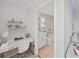 Bright bathroom with white vanity, bathtub, and separate shower at 2302 Village Amble Loop, Lutz, FL 33558