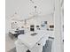 Bright dining area with white table and chairs near kitchen at 2302 Village Amble Loop, Lutz, FL 33558
