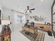 Modern home office with a large desk, built-in shelving, and a chevron patterned rug at 2302 Village Amble Loop, Lutz, FL 33558