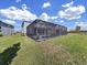 House exterior showcasing backyard oasis at 2302 Village Amble Loop, Lutz, FL 33558