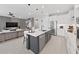 Open concept kitchen with island and living area view at 2302 Village Amble Loop, Lutz, FL 33558