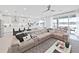 Spacious living room with sectional sofa and view of pool at 2302 Village Amble Loop, Lutz, FL 33558