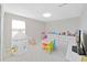 Fun playroom featuring a colorful ' table, teepee, and plenty of storage at 2302 Village Amble Loop, Lutz, FL 33558
