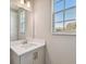 A shot of the bathroom sink and window with natural light at 3022 W Cass St, Tampa, FL 33609