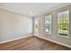 Sun-filled home office featuring hardwood floors, ample natural light, and neutral wall paint at 3022 W Cass St, Tampa, FL 33609