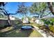 Spacious backyard features a large outdoor table and a storage shed for all your gardening needs at 3621 S Belcher Dr, Tampa, FL 33629