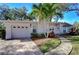 Exterior view of a well-kept single-story home with an attached garage and mature landscaping at 3621 S Belcher Dr, Tampa, FL 33629