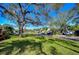 Residential street showcasing mature trees, lush lawns, and a peaceful neighborhood ambiance at 3621 S Belcher Dr, Tampa, FL 33629