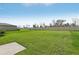 Expansive backyard with green grass and a privacy fence bordering the property at 3827 Radiant Mountain Dr, Plant City, FL 33565