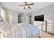 Bright primary bedroom features natural light, neutral walls, carpet, ceiling fan and spacious layout at 4509 Golden Gate Cv, Bradenton, FL 34211
