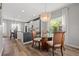 Cozy dining area with a modern chandelier and a view of the kitchen at 4509 Golden Gate Cv, Bradenton, FL 34211
