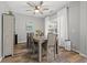Cozy dining room with hardwood floors, large window, and wooden dining table at 4509 Golden Gate Cv, Bradenton, FL 34211