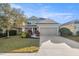 Charming two-story home with a well-manicured lawn and a spacious two-car garage at 4509 Golden Gate Cv, Bradenton, FL 34211