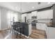 Modern kitchen with stainless steel appliances, white cabinets and a breakfast bar at 4509 Golden Gate Cv, Bradenton, FL 34211