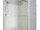 Bathroom shower features white subway tile, dual shower heads and a clear glass door at 4509 Golden Gate Cv, Bradenton, FL 34211