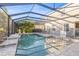 Sparkling swimming pool with a screened enclosure offering privacy and enjoyment at 4509 Golden Gate Cv, Bradenton, FL 34211