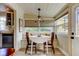 Bright dining nook with a cozy breakfast table, built-in bench, and view into the kitchen at 520 48Th N Ave, St Petersburg, FL 33703