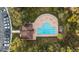 Overhead view of a community pool and lounge area surrounded by lush landscaping at 5914 Falconwood Pl, Lithia, FL 33547