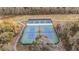 Overhead view of a community tennis court with a well-maintained playing surface at 5914 Falconwood Pl, Lithia, FL 33547