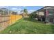 A spacious backyard featuring a well-maintained lawn and a privacy fence at 5914 Falconwood Pl, Lithia, FL 33547