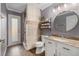 Updated bathroom with tiled shower and granite vanity at 5914 Falconwood Pl, Lithia, FL 33547