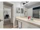 Bright bathroom with a single sink vanity and access to another room at 5914 Falconwood Pl, Lithia, FL 33547