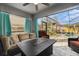Inviting screened-in lanai with comfortable seating and views of the refreshing pool area at 5914 Falconwood Pl, Lithia, FL 33547
