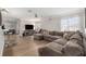 Spacious living room with large sectional sofa and natural light at 5914 Falconwood Pl, Lithia, FL 33547